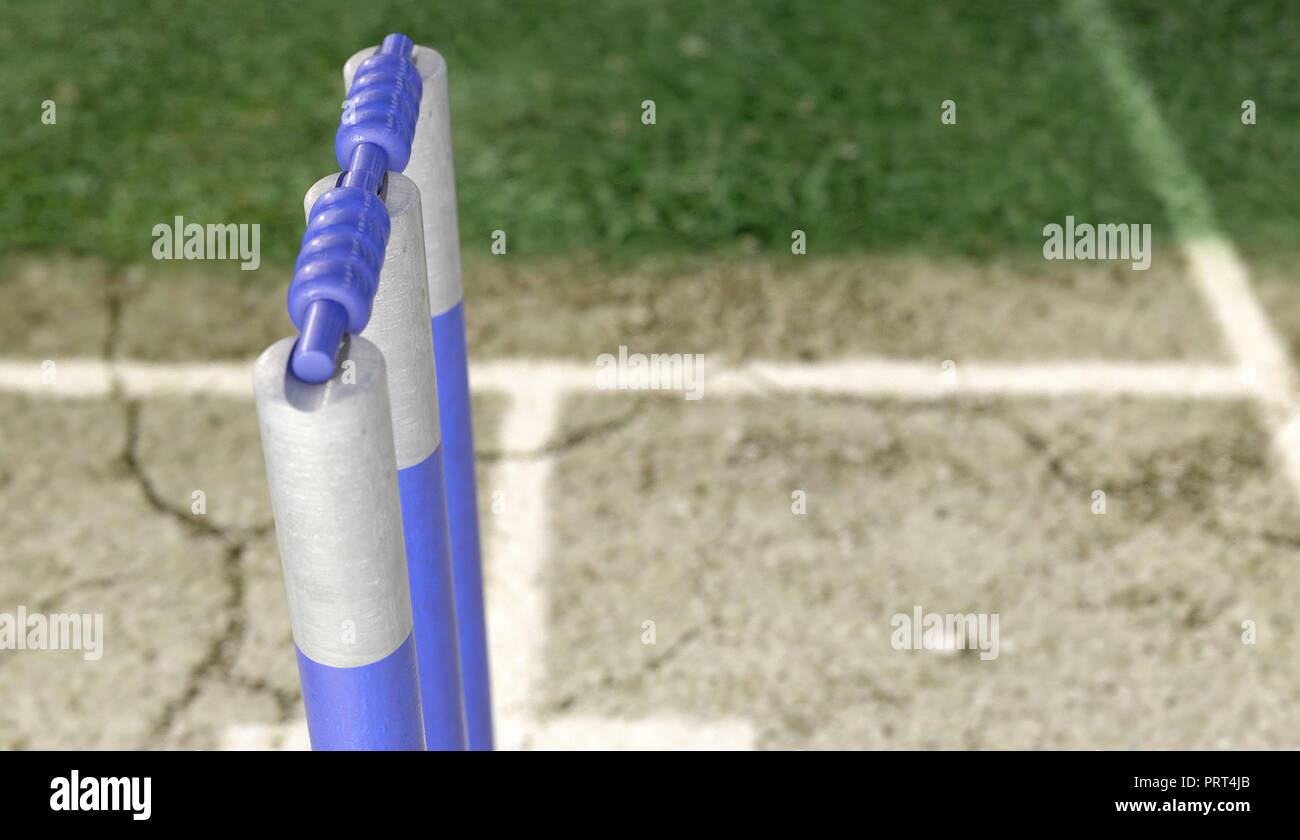 Eine Reihe von Blue cricket Wickets, die auf eine gerissene Rasenplatz Hintergrund - 3D-Rendering Stockfoto
