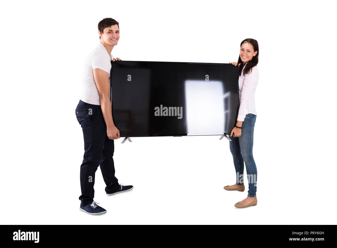 Portrait eines glücklichen Paar hält Fernsehen auf weißem Hintergrund Stockfoto