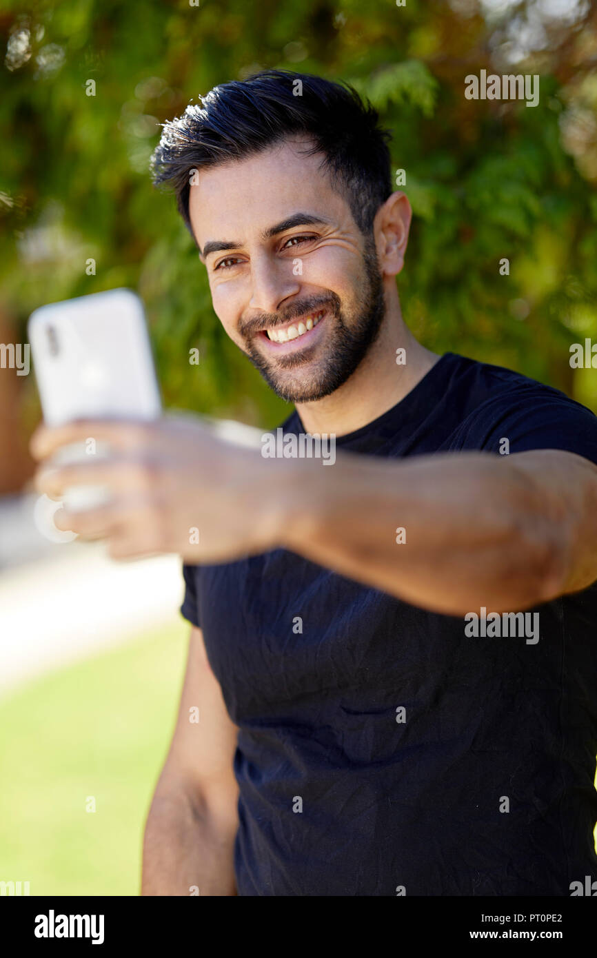Männliche eine selfie mit seinem Telefon Stockfoto