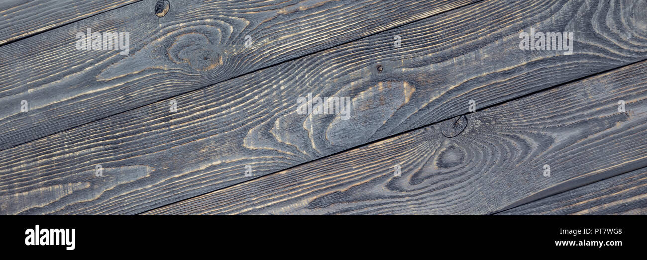 Dunkler Hintergrund Textur aus Holz Bretter mit farbresten. Diagonal. Stockfoto