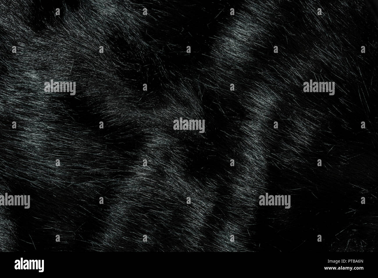 Sehr detaillierte Hintergrund Textur von schwarzen Fell aus synthetischem Tier lange Haare. Stockfoto