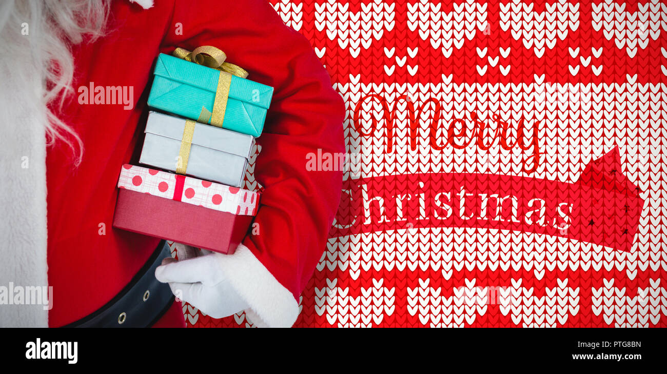Das zusammengesetzte Bild von Santa Claus holding Geschenkboxen Stockfoto