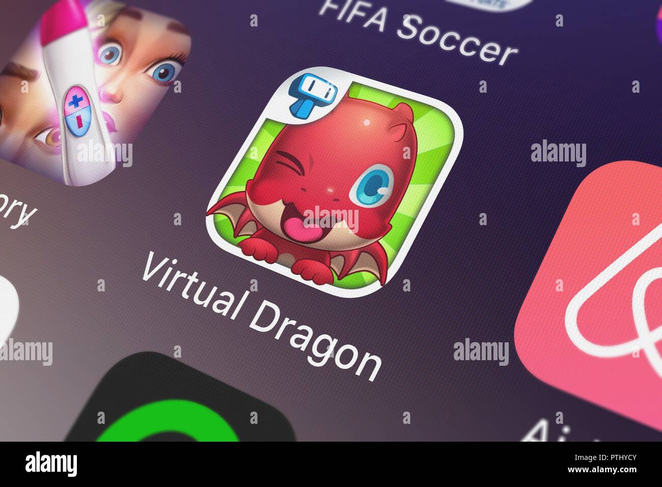 London, Großbritannien - 09.Oktober 2018: Screenshot der mobile App Meine Virtuelle Drachen - Pocket Pet Monster mit Mini Spiele für Zicklein von tapps Tec Stockfoto