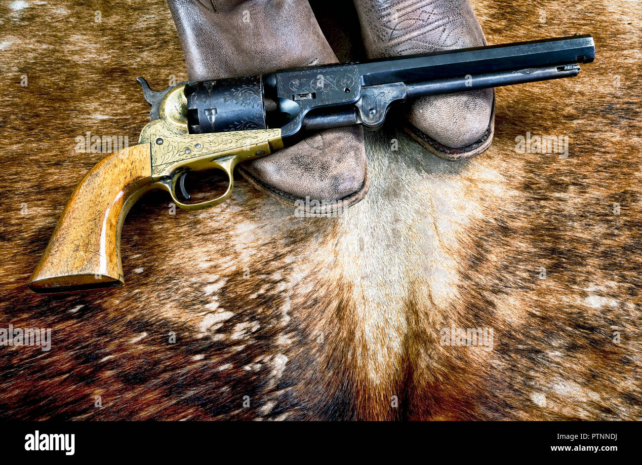 Cowboystiefel und Western Cowboy Pistole. Stockfoto
