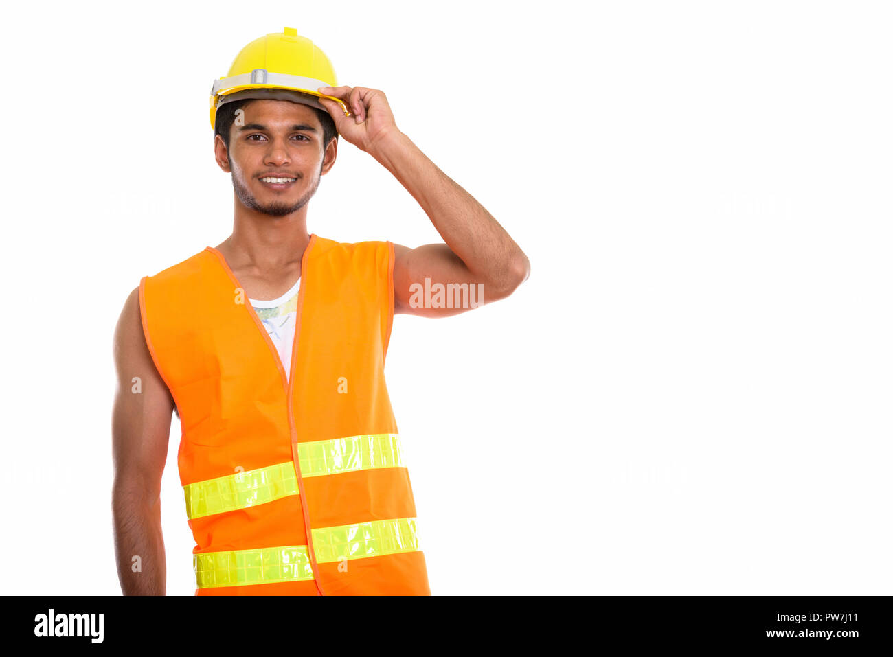 Junge glücklich Inder Bauarbeiter lächelnd, während sie Stockfoto