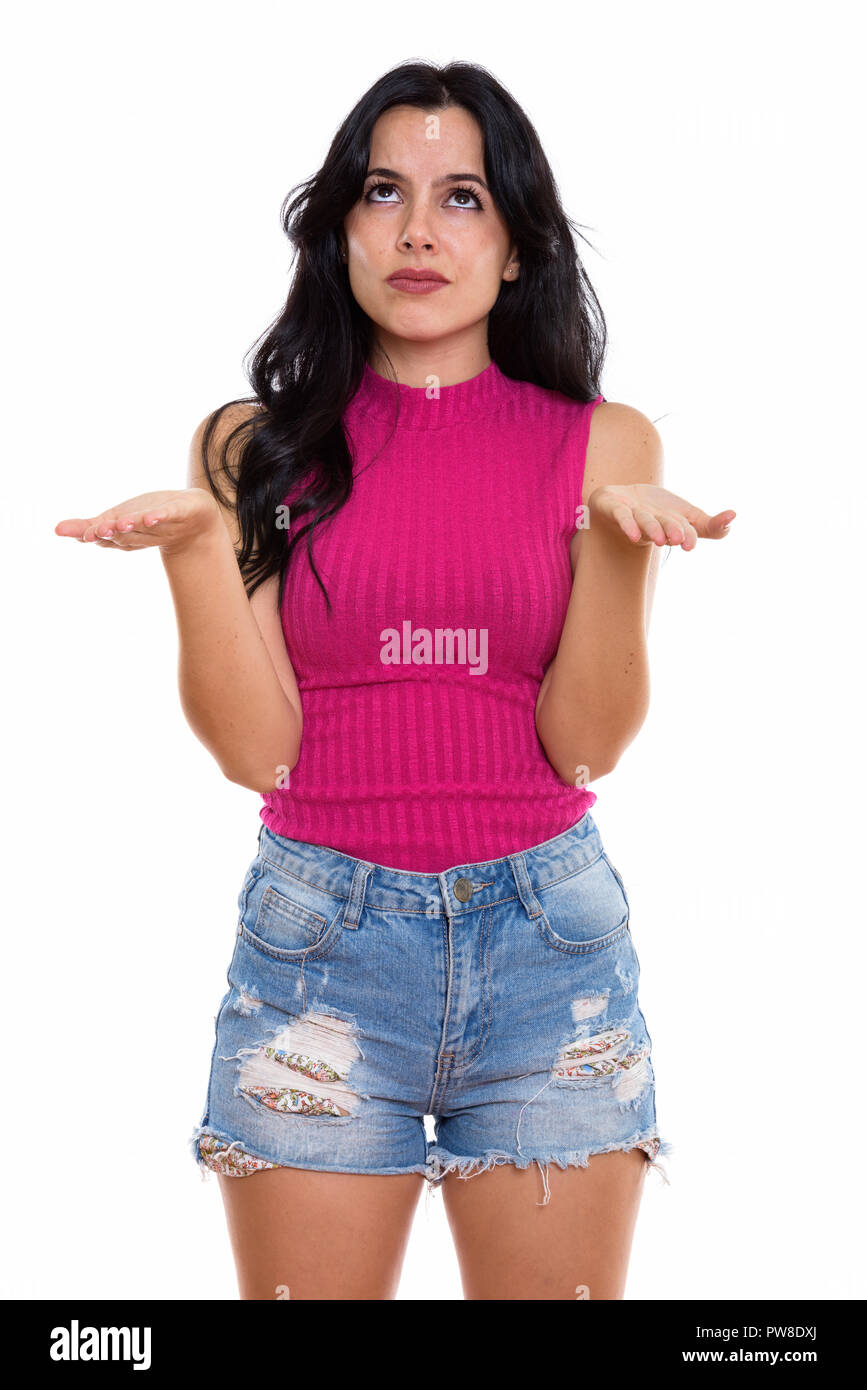 Studio shot der jungen schönen spanischen Frau denken beim Blick Stockfoto