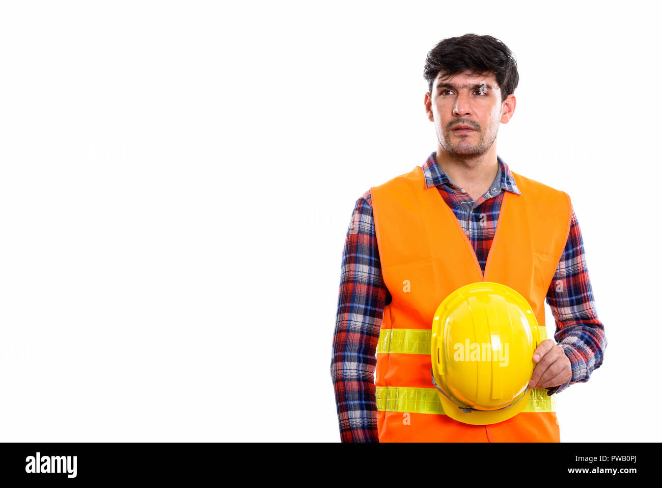 Jungen persischen Mann Bauarbeiter holding Schutzhelm whil Stockfoto