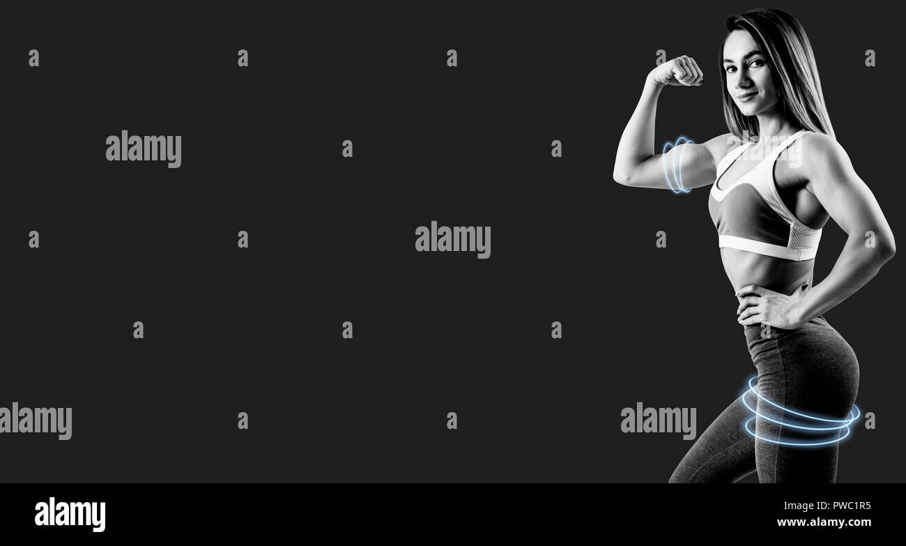 Schwarze und weiße Schoß der Frau in Sportswear demonstriert ihre muskulösen Körper. Stockfoto