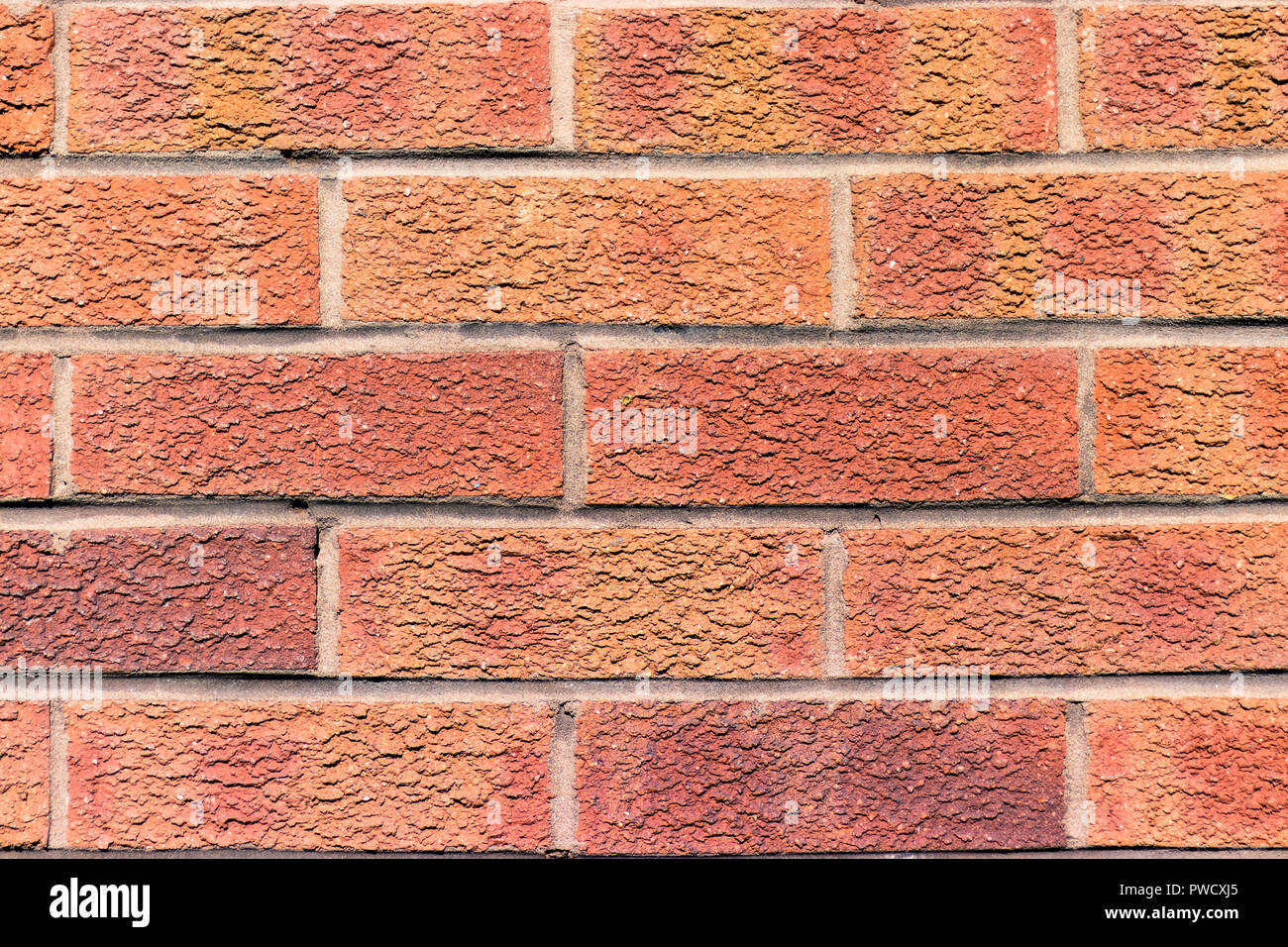 Alte rote Ziegel Wand im Sonnenlicht, nahtlose Hintergrund Foto Textur Stockfoto