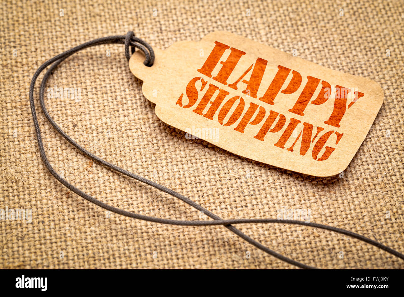 Happy Shopping Zeichen - ein Papier Preis Variable mit einem Garn iagainst Leinwand Leinwand Stockfoto