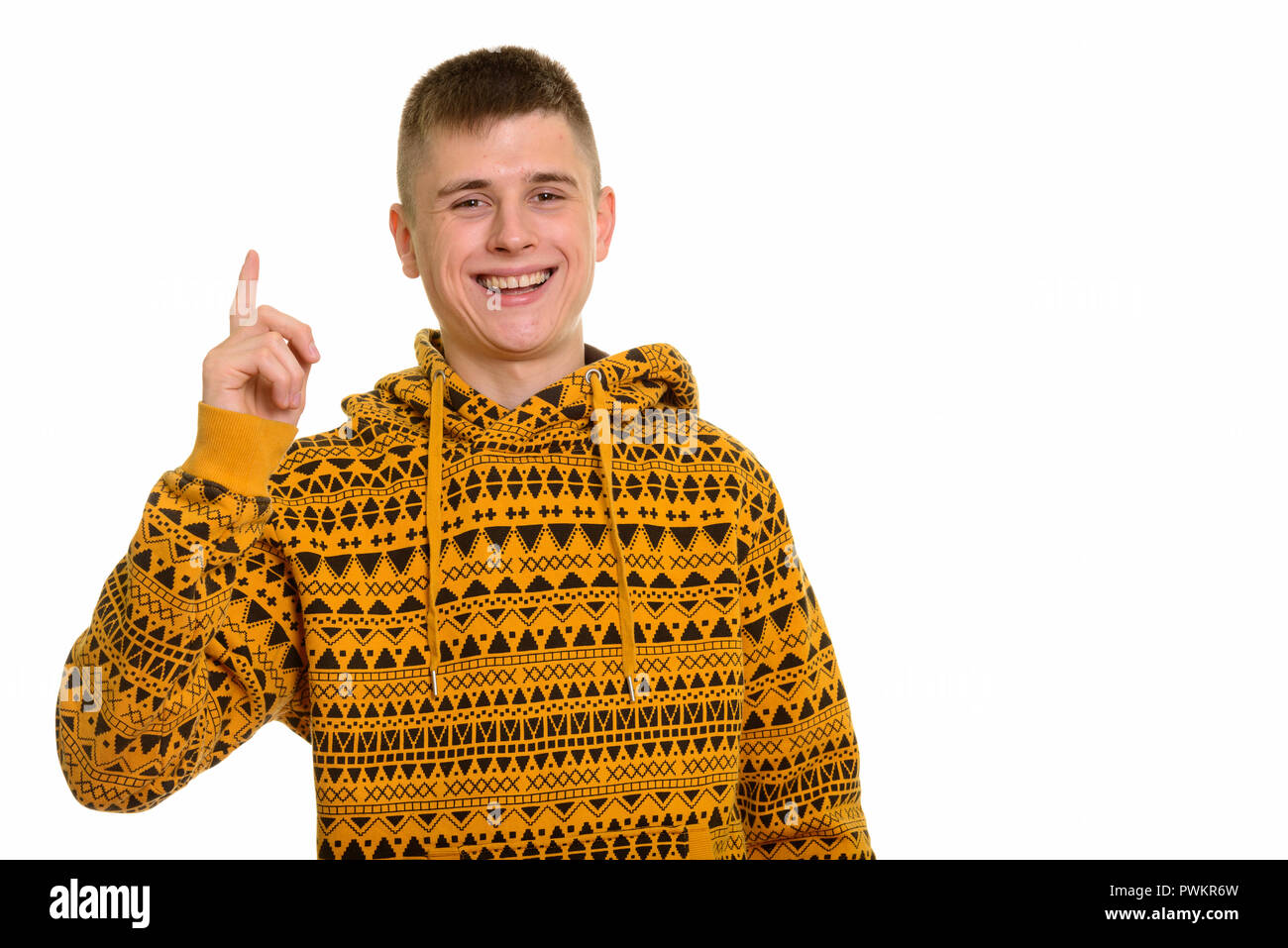 Junge glücklich kaukasischen Mann lächelnd und zeigen mit dem Finger auf Stockfoto