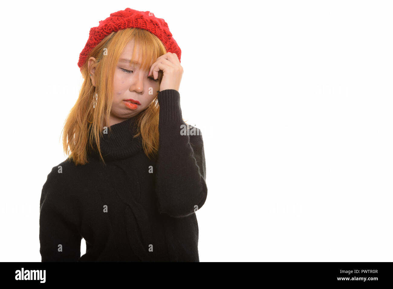 Junge süße asiatische Frau mit Kopfschmerzen und Stress Stockfoto