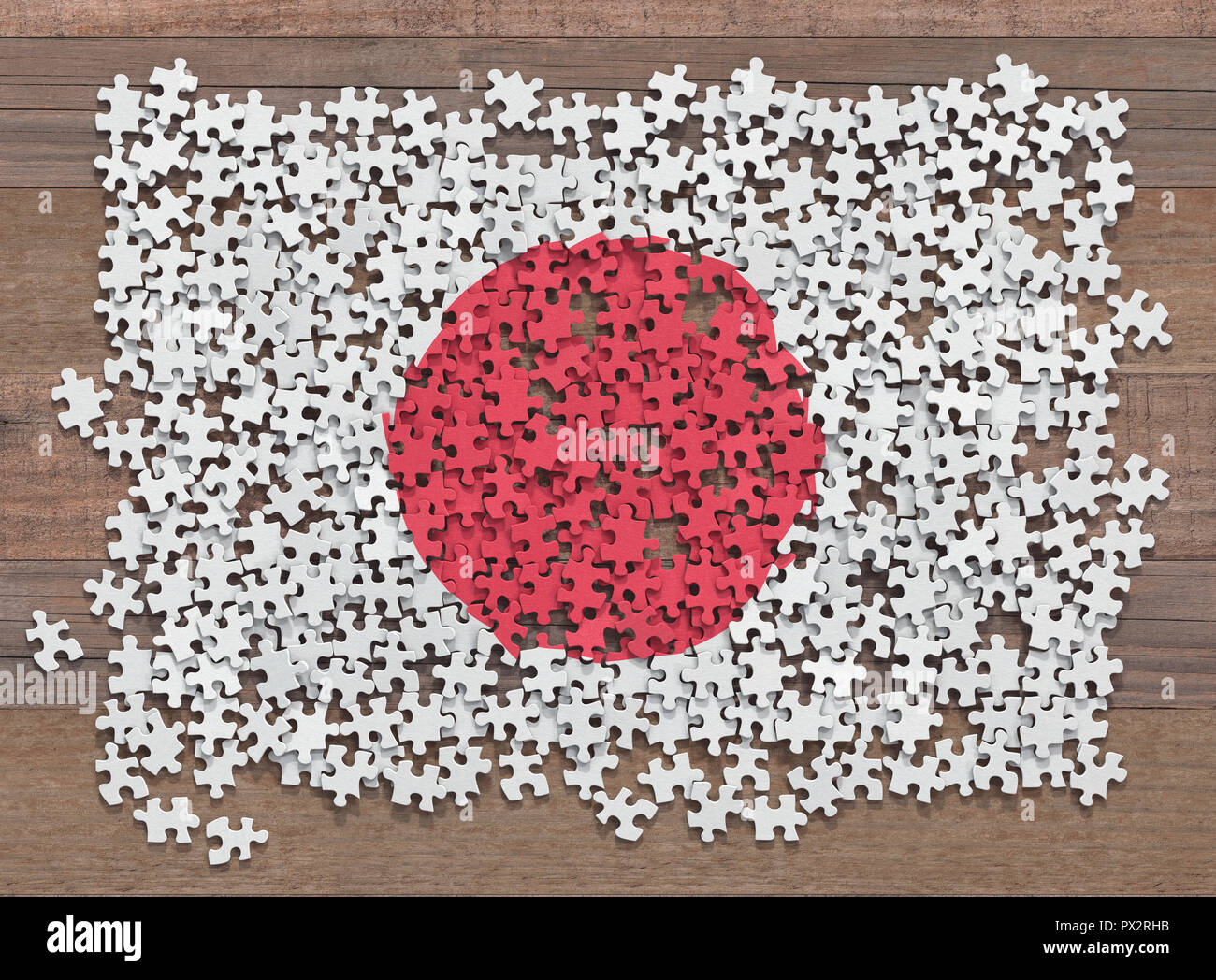 Flagge der Japan in ungeordneten Teile eines Puzzles. Stockfoto