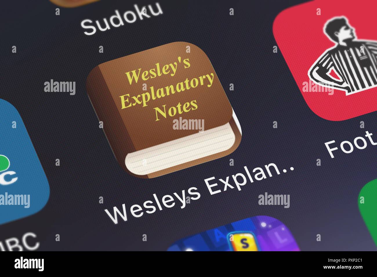 London, Großbritannien, 23. Oktober 2018: Der Wesley Erläuterungen mit 1545 Bibelverse mobile App von Oleg Shukalovich auf einem iPhone Bildschirm. Stockfoto
