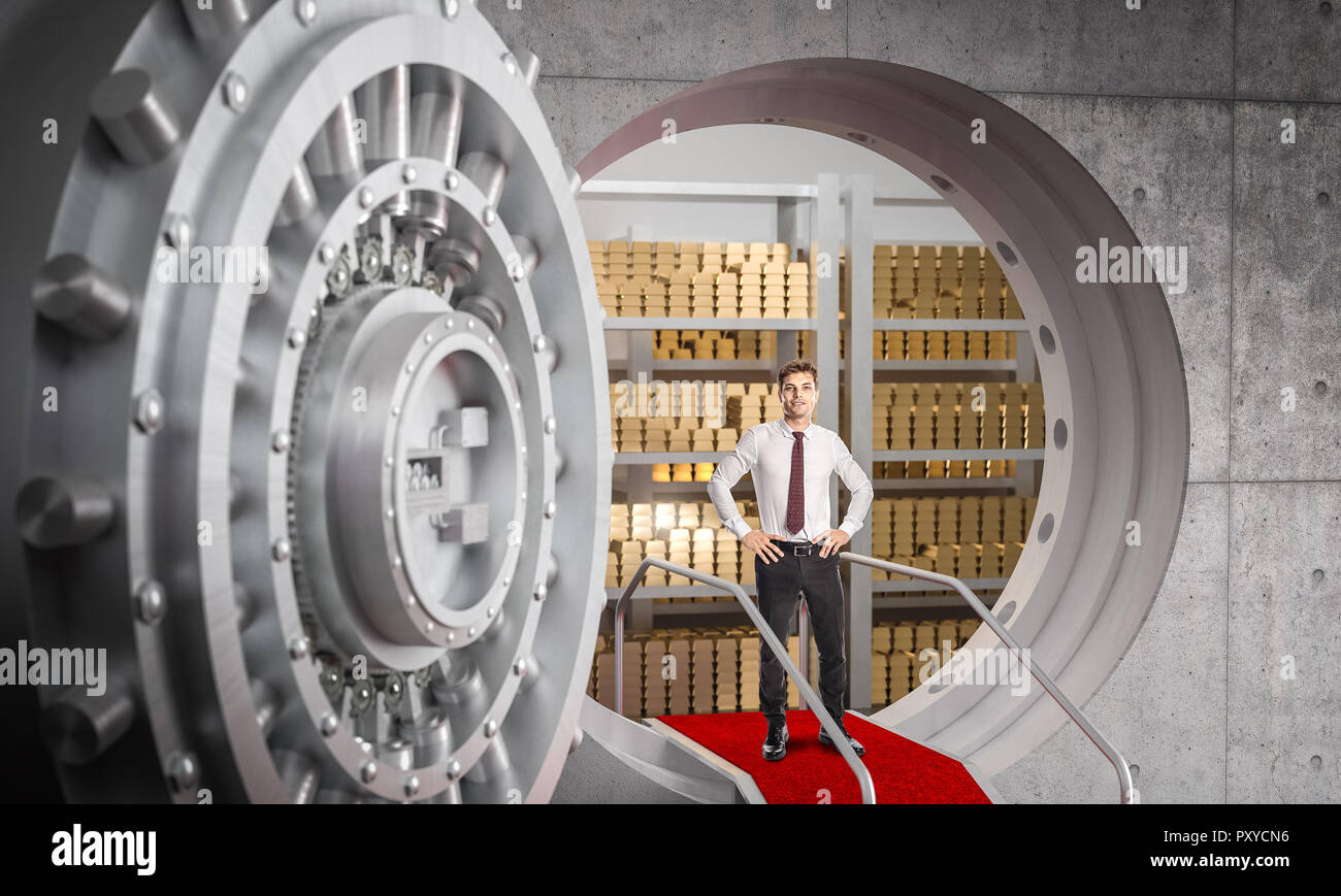 Geschäftsmann und riesige Bank vault Hintergrund Stockfoto