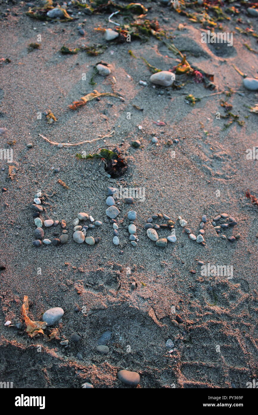 Glauben Nachricht am Strand Ufer Stockfoto
