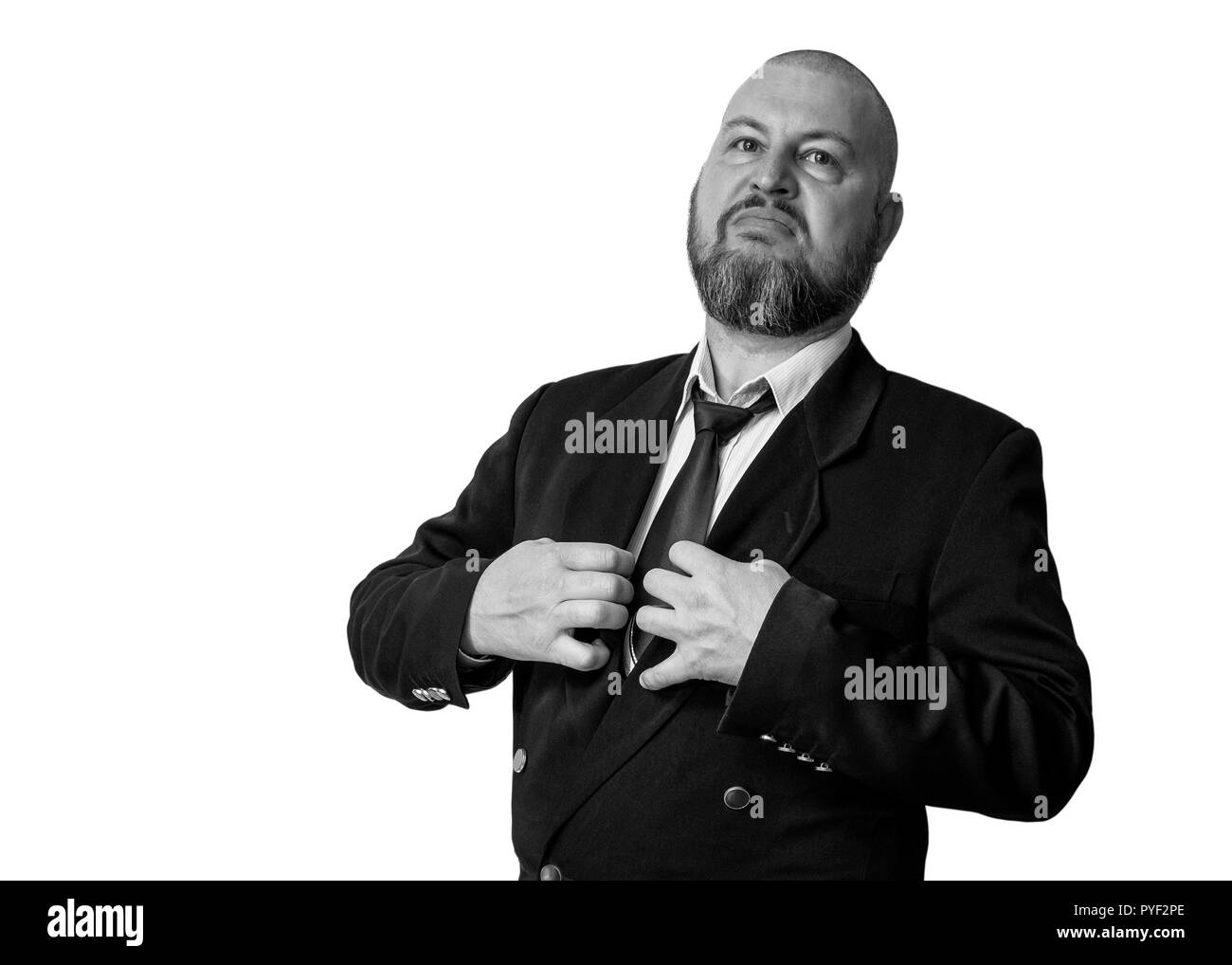 Der Mann, der den Stolzen und stolzen Blick in eine Jacke mit einem Riegel und einen Bart. Schwarzweiß-Foto. Stockfoto
