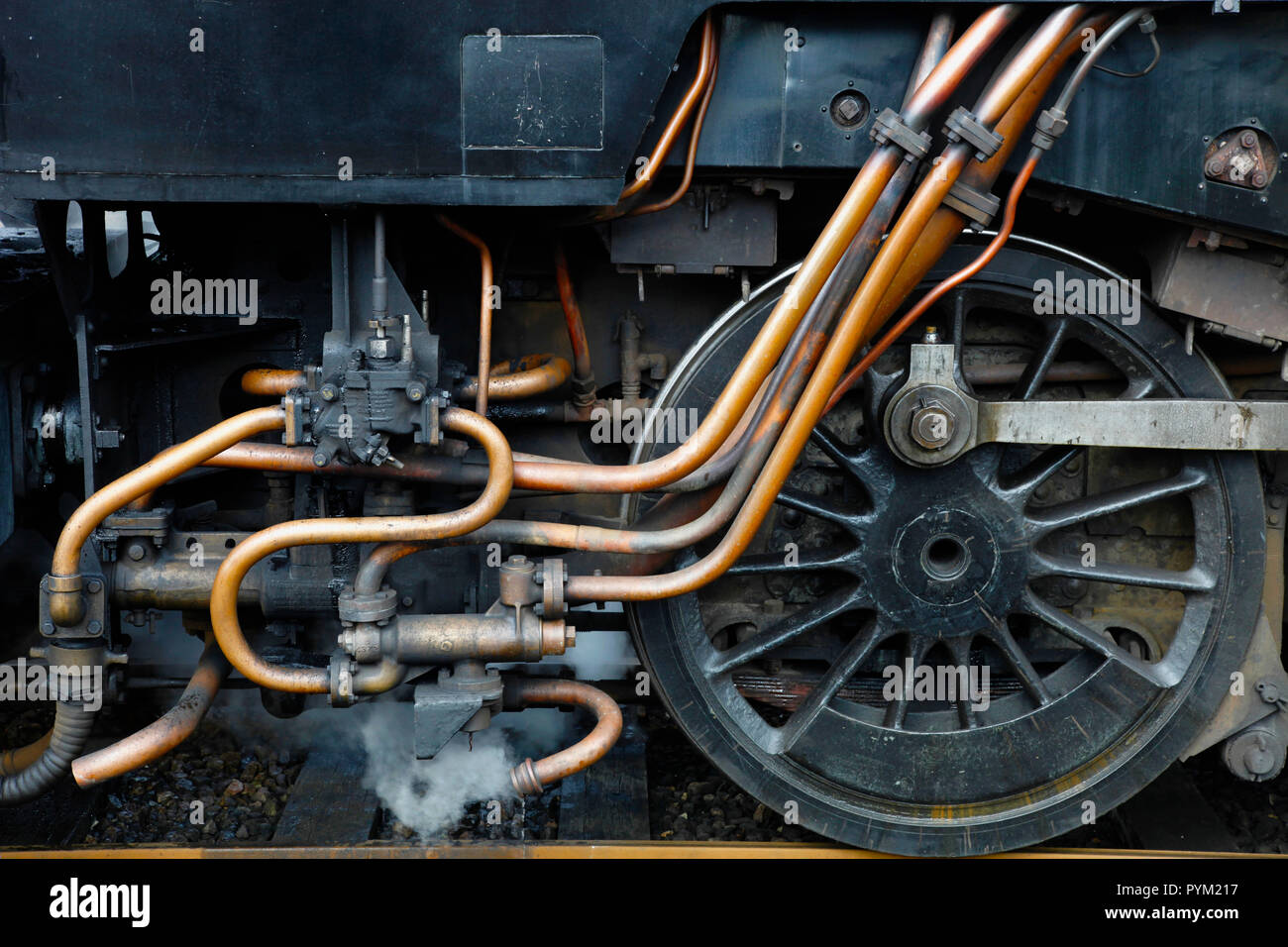 Verkehr, Eisenbahn, Dampf, Detail, Rohrleitungen und Rädern. Stockfoto