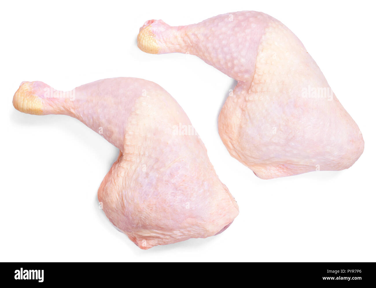 Frisches rohes Hühnerfleisch, auf weißem Hintergrund. Chicken Drumsticks oder Beine, Ansicht von oben. Stockfoto