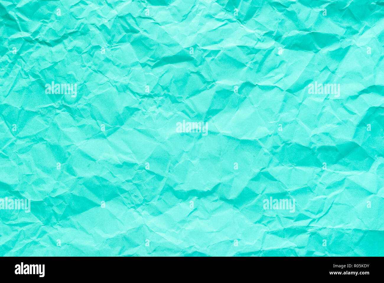 Cyan, helles Grün zerknittertes Papier Textur Hintergrund. Stockfoto