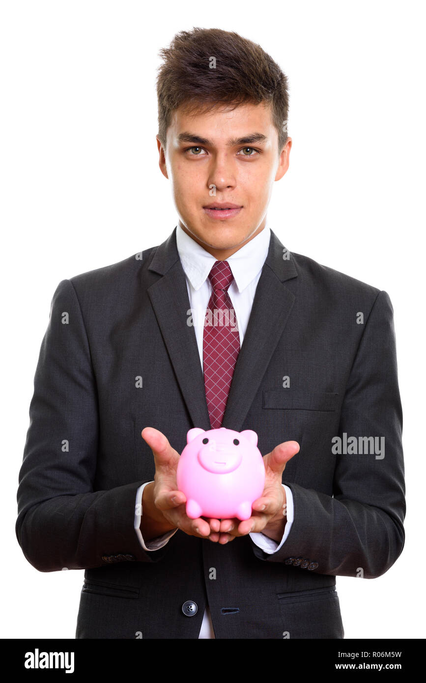Studio shot von jungen hübschen Geschäftsmann Holding piggy Bank Stockfoto
