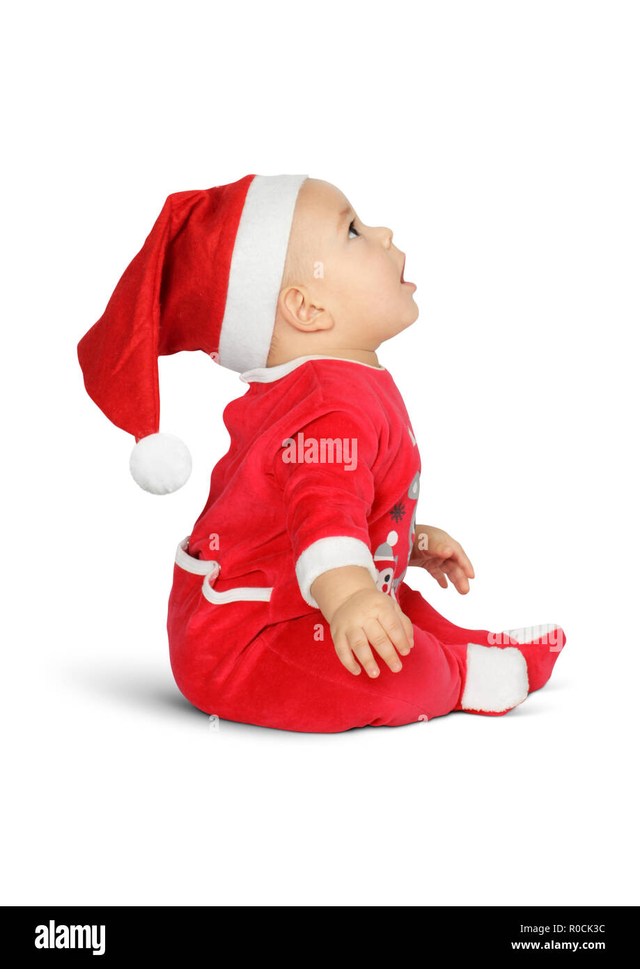 Überrascht Baby Santa Claus isoleted auf weissem, Seitenansicht Stockfoto