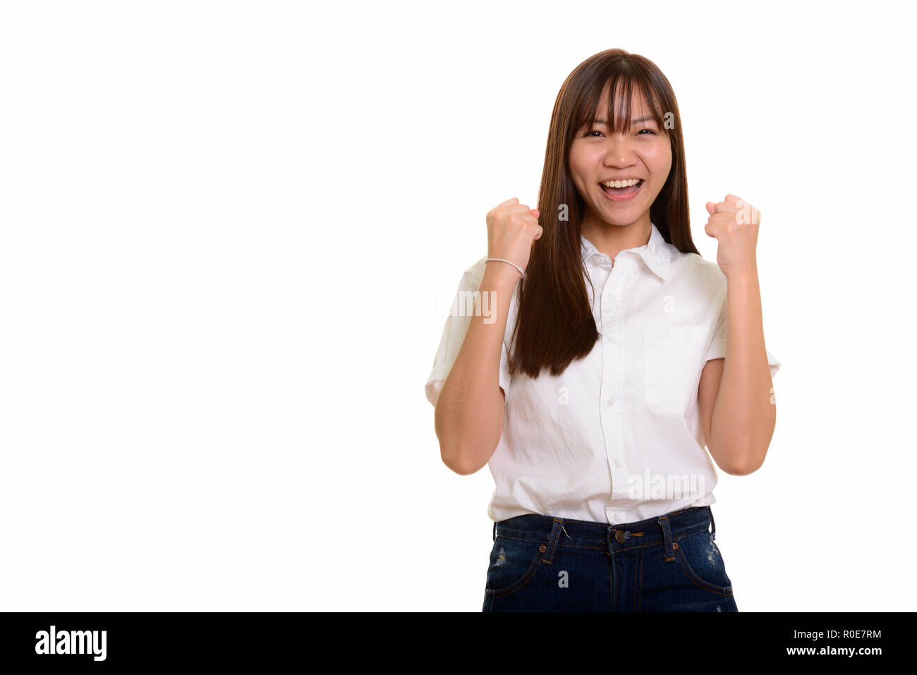 Junge glücklich Asiatischen Teenager Mädchen lächelnd Suchen motiviert Stockfoto