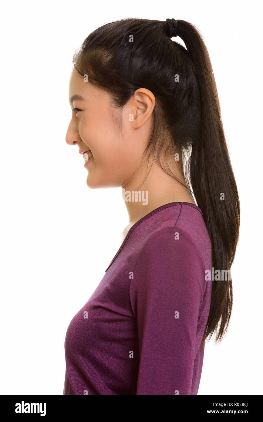 Profil anzeigen von Jungen glücklich Asiatischen Teenager Mädchen lächelnd Stockfoto