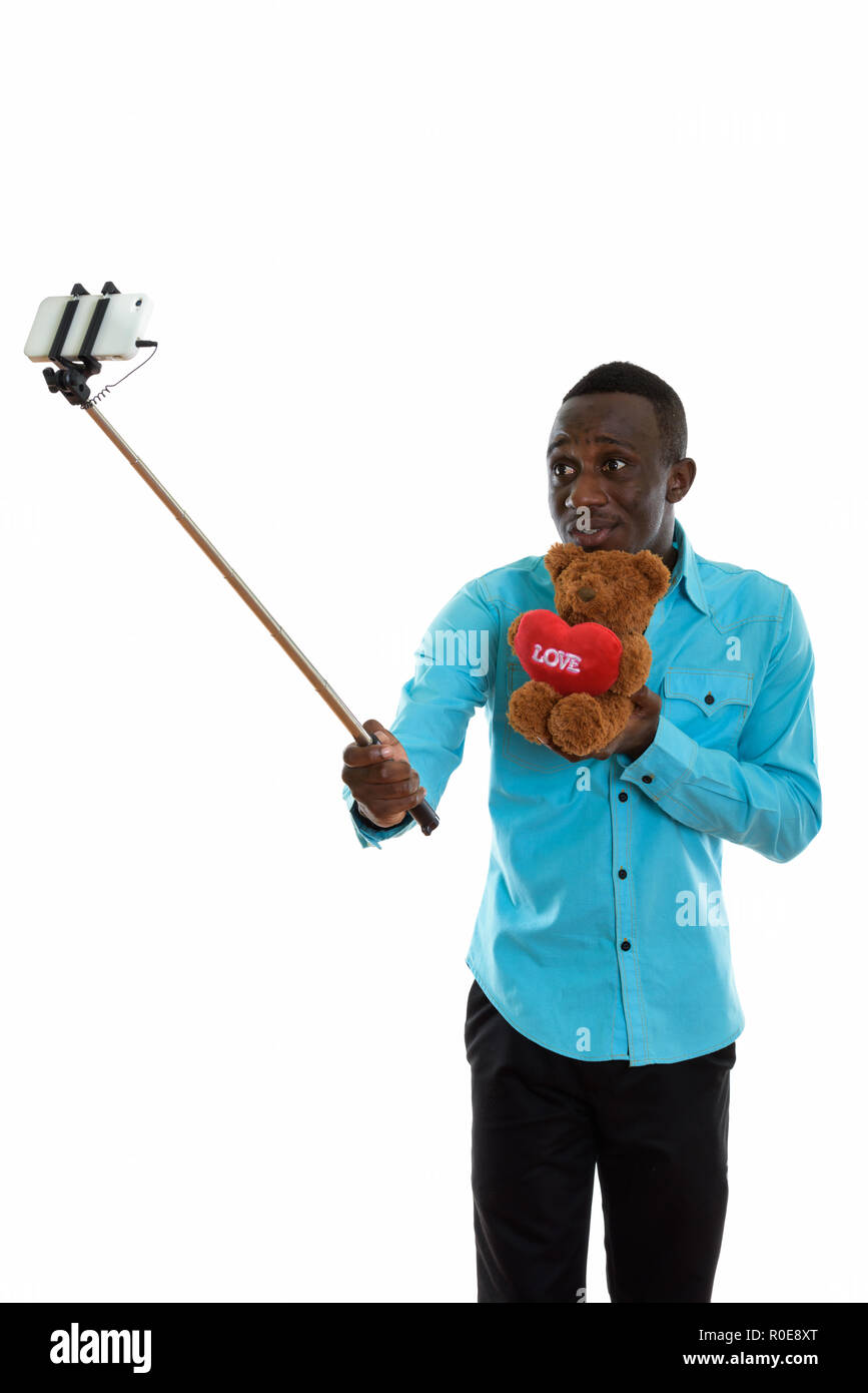 Jungen schwarzen afrikanischen Mann mit Teddybär mit Herz und Liebe s Stockfoto