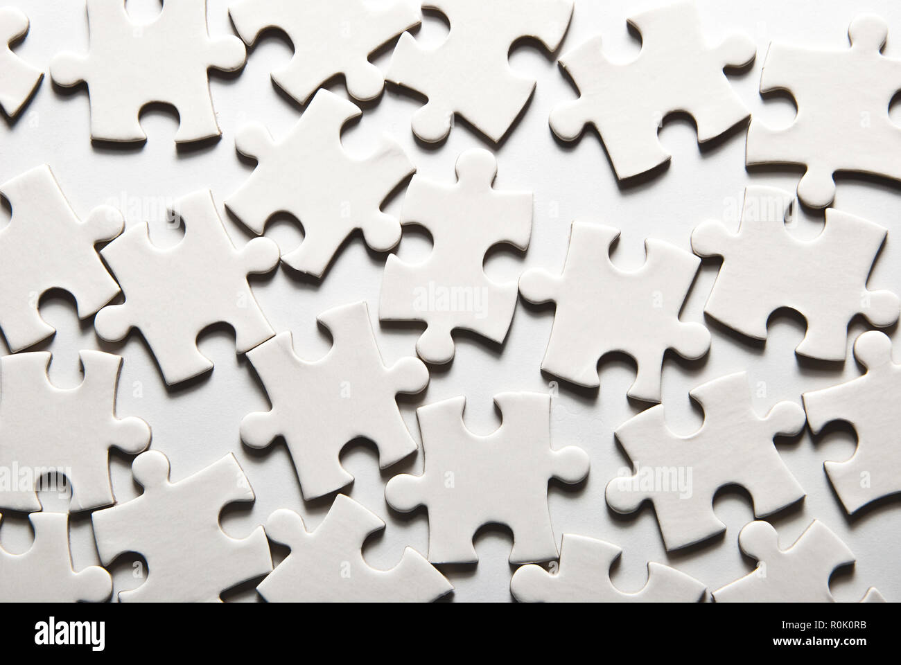 Weißen Puzzleteile als Hintergrund Stockfoto