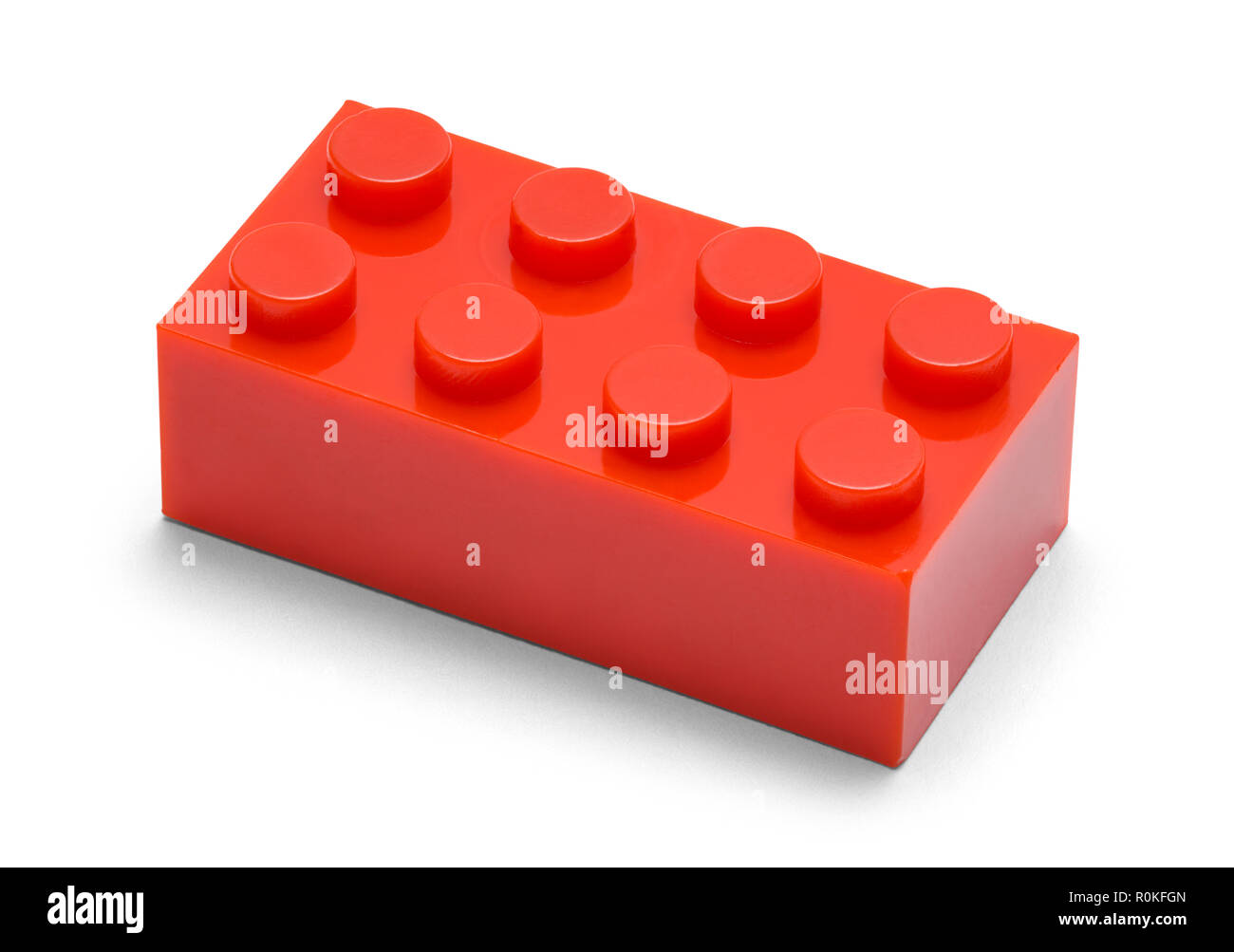 Einzelne rote Kunststoff Ziegel auf einem weißen Hintergrund. Stockfoto