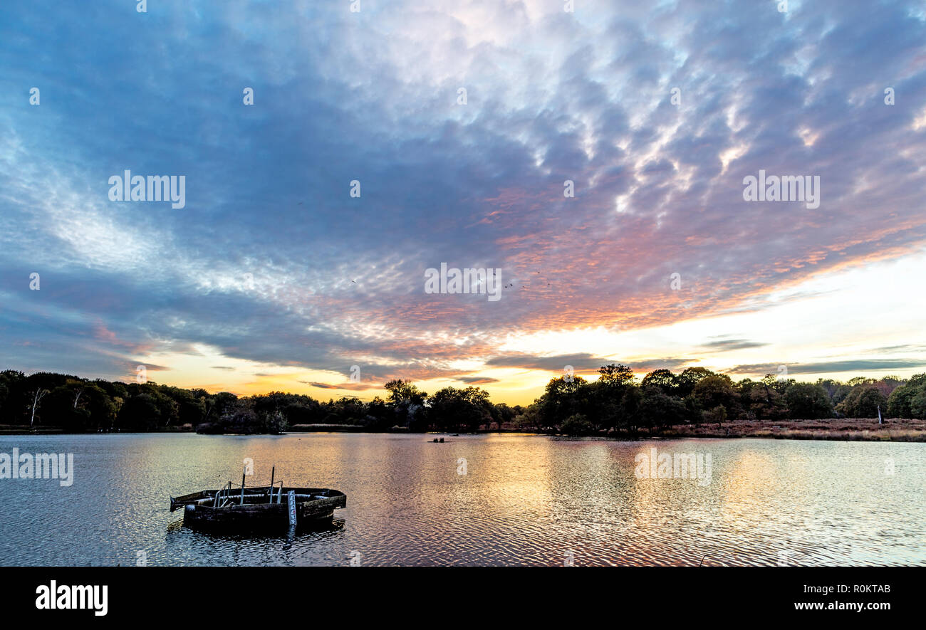 Sonnenuntergang über Pen Teiche See Richmond Park London UK Stockfoto