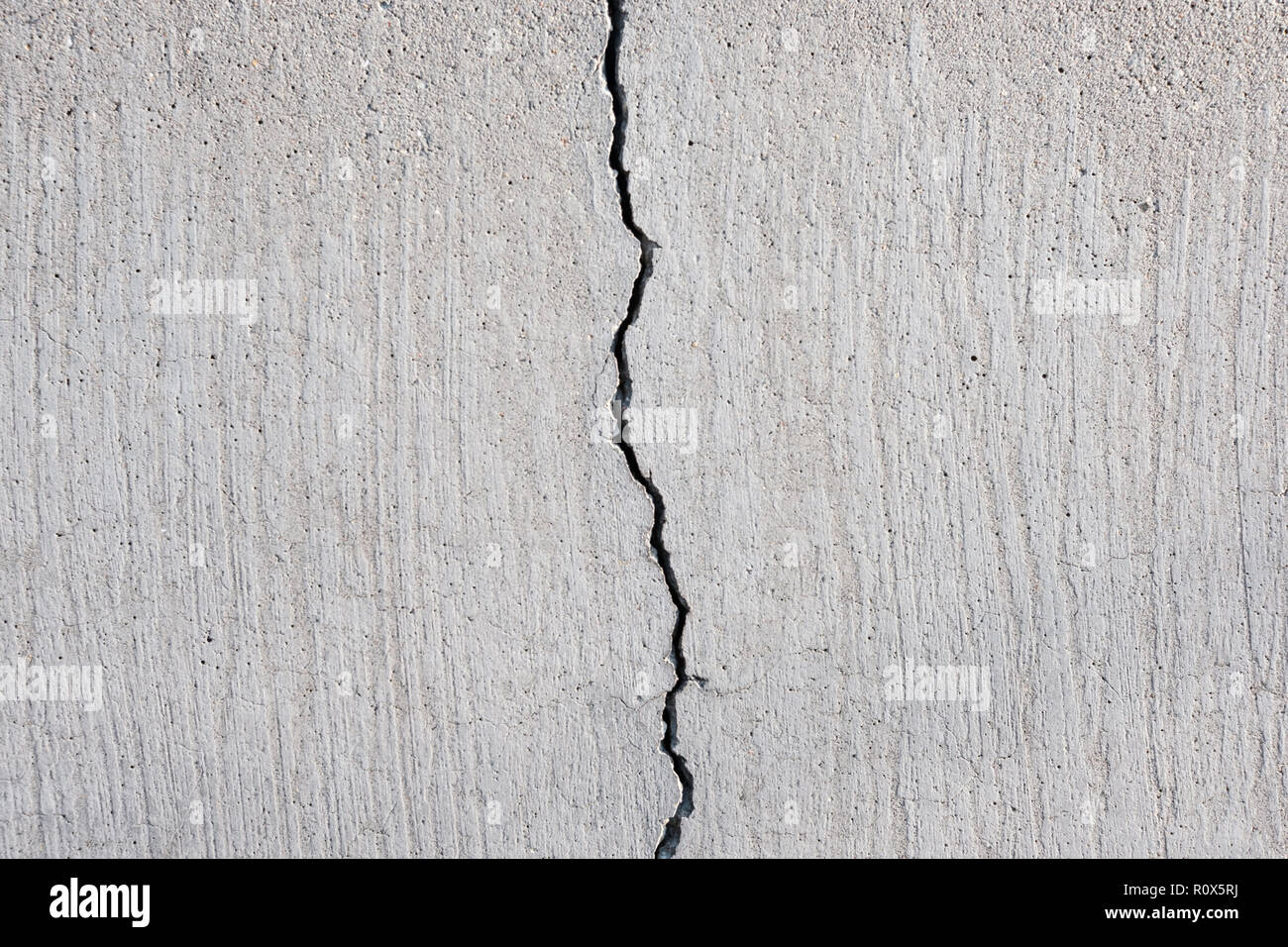 Gerissenen Beton Textur, Riss in der Mauer aus Stein Stockfoto