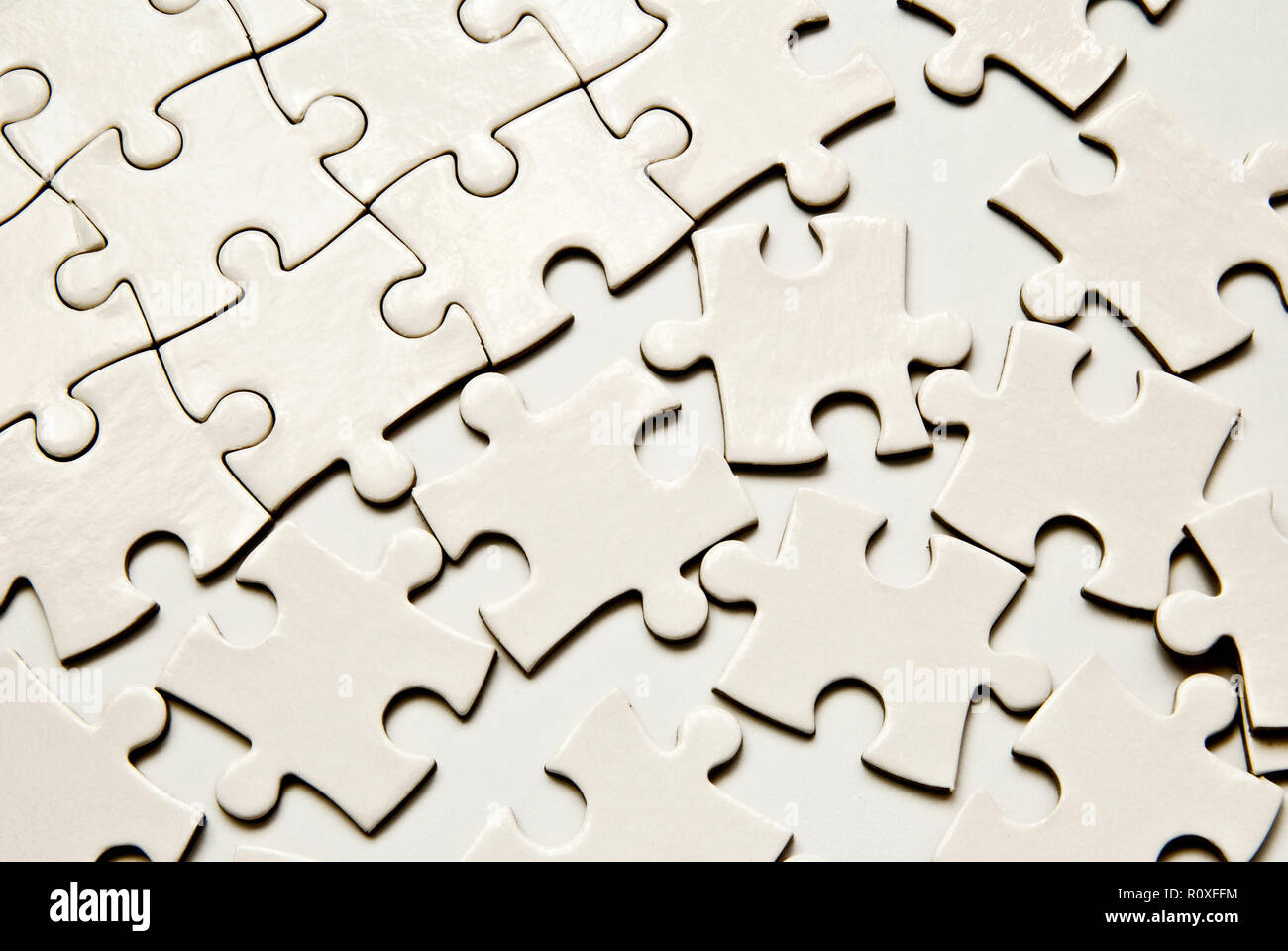 Weißen Puzzleteile als Hintergrund Stockfoto