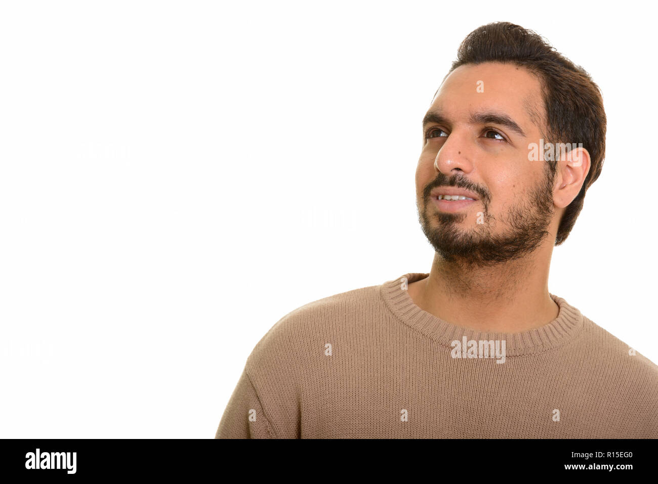 Junge glücklich Inder denken und suchen Stockfoto