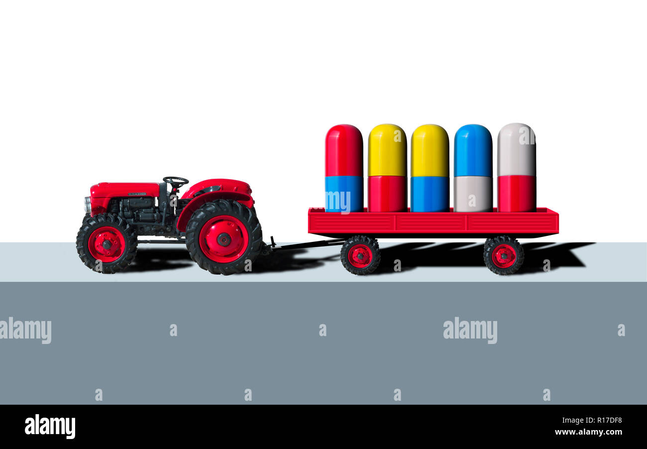 Pille Landwirtschaft oder Pharming, Spielzeug Traktor und Anhänger transportieren Pille Kapseln Stockfoto