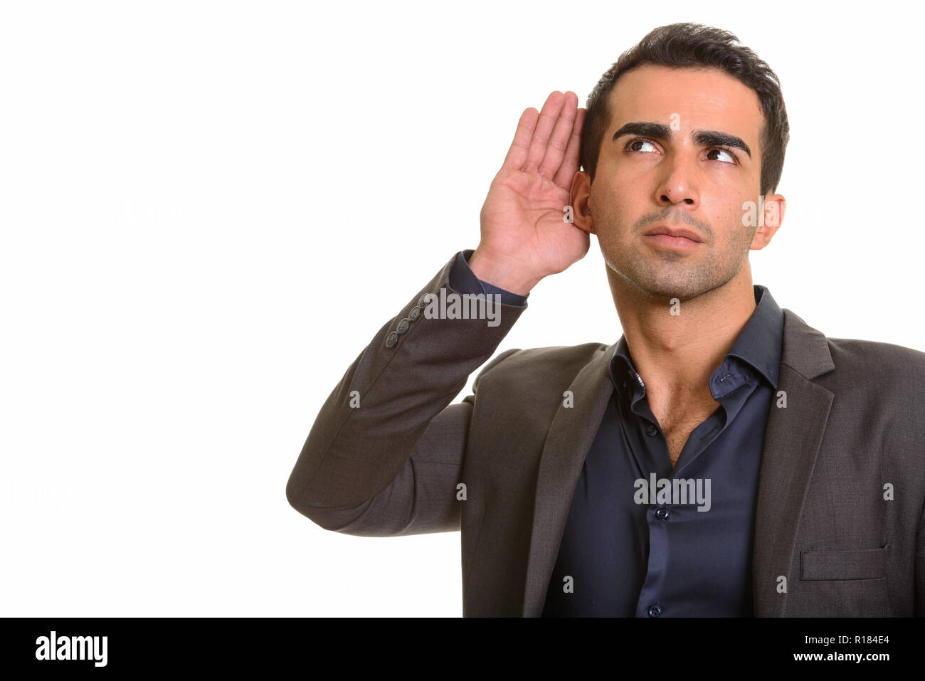 Porträt der jungen schönen persischen Geschäftsmann zuhören Stockfoto
