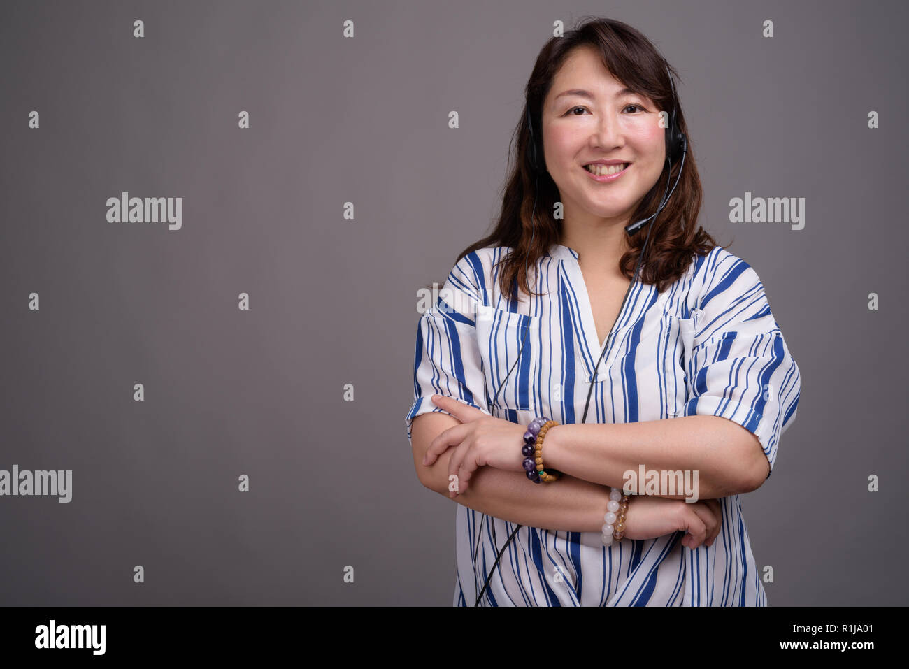 Portrait von Reifen Asiatische call center Vertreter Geschäftsfrau Stockfoto