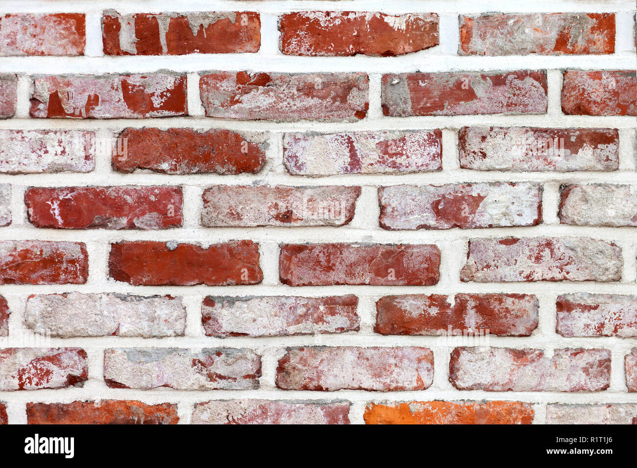 Ziegelwand Hintergrund mit weißem Putz Stockfoto