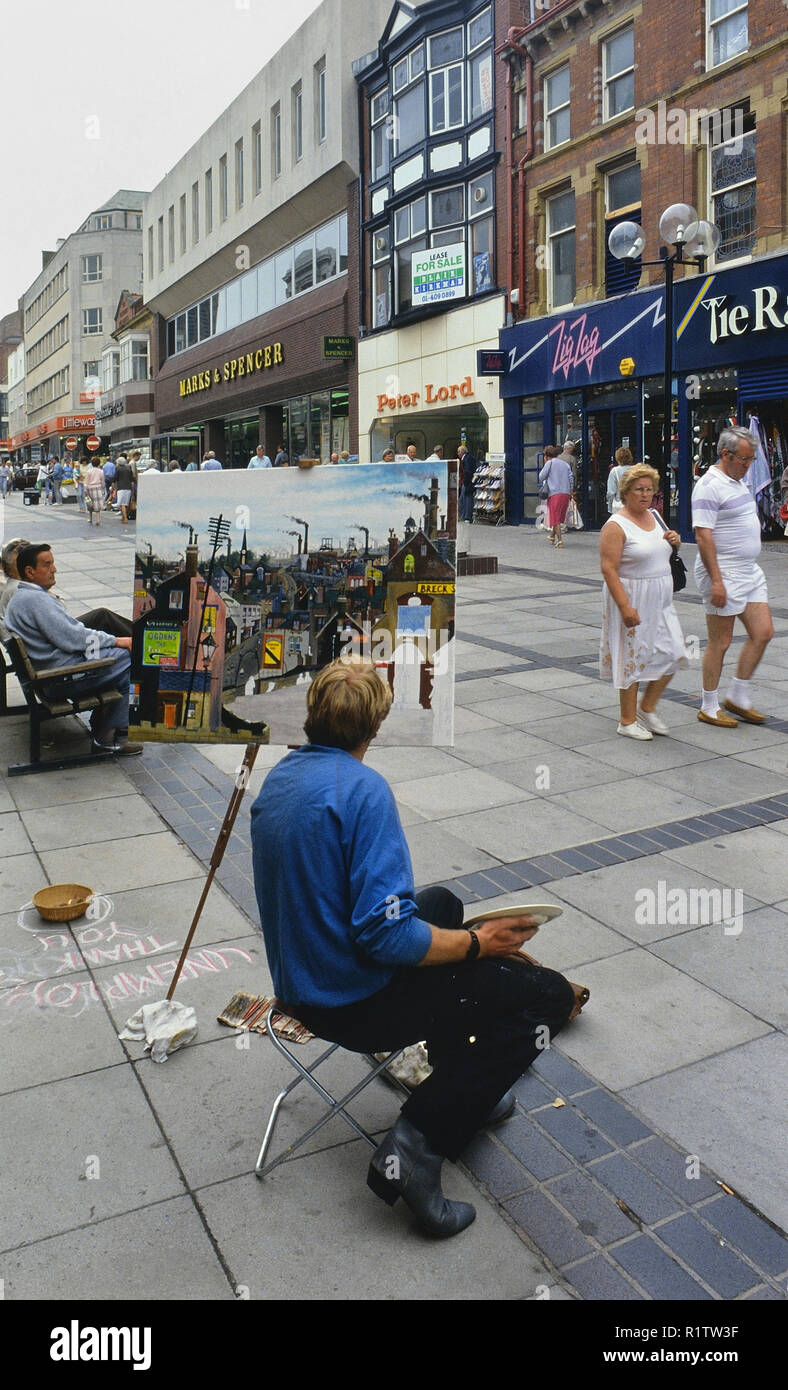 Arbeitslosen bildenden Künstlers Malerei auf den Straßen von Blackpool, Lancashire, England, Großbritannien Stockfoto