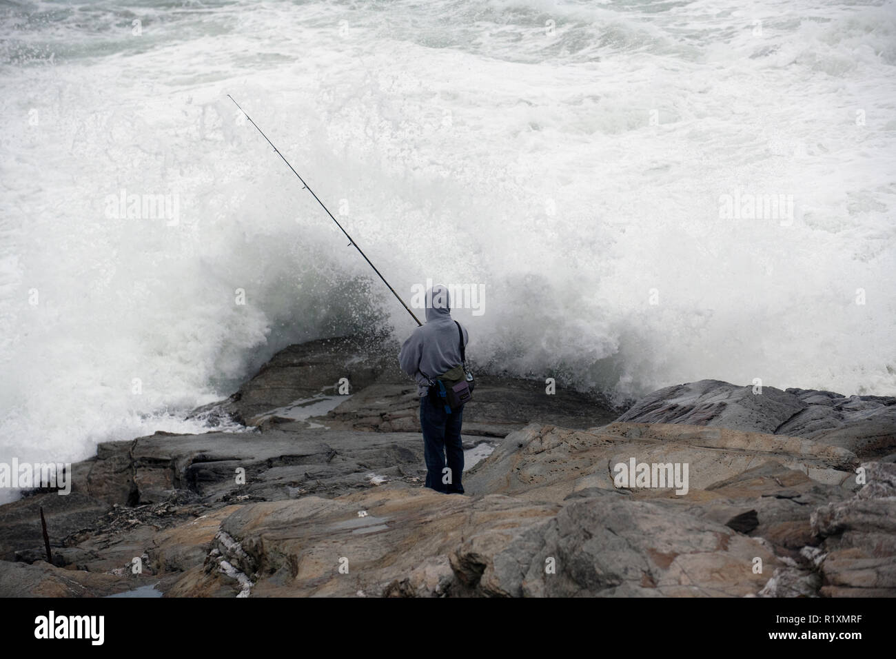 Angeln aus aus der Beavertail Leuchtturm in Jamestown, Rhode Island Stockfoto