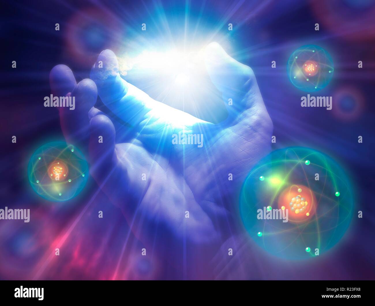 Konzeptionelle Darstellung der Schöpfung. Eine Hand wird mit Licht und Atomen von Ihm ausgeht. Stockfoto