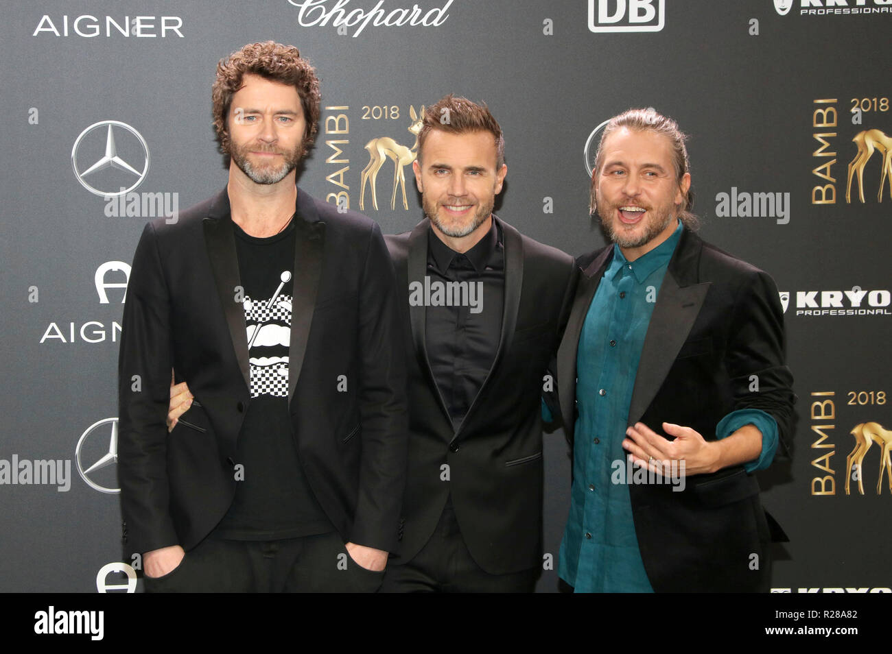 Howard Donald, Gary Barlow und Mark Owen von der Band, dass die Teilnahme an der 70. Bambi Awards auf der Bühne Theater am 16. November 2018 in Berlin, Deutschland. Stockfoto