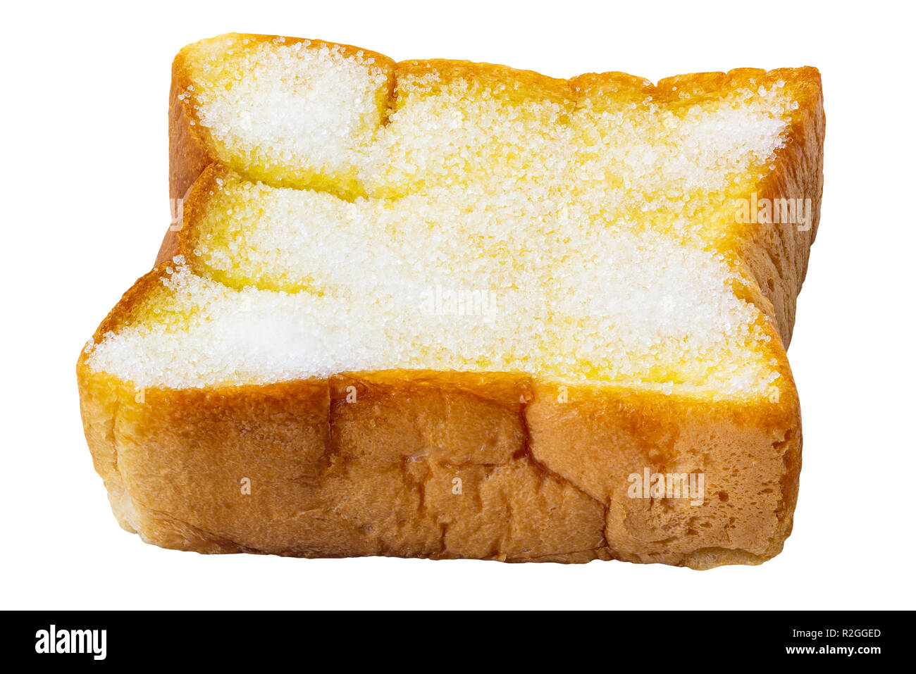 Geschnittenes Brot spreaded mit Butter und Zucker, auf weißem Hintergrund Stockfoto
