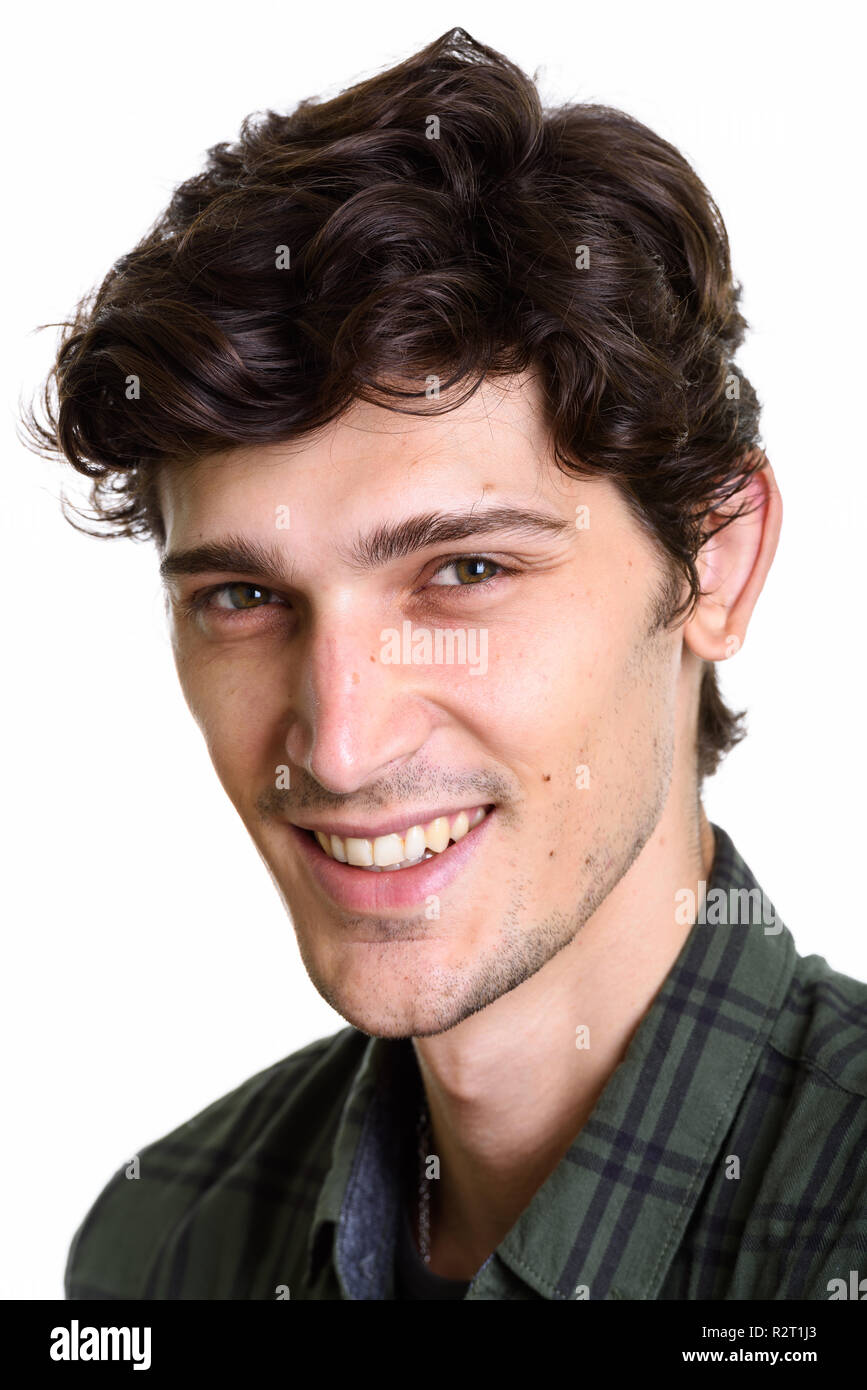 Gesicht der jungen gutaussehenden Mann glücklich lächelnd Stockfoto