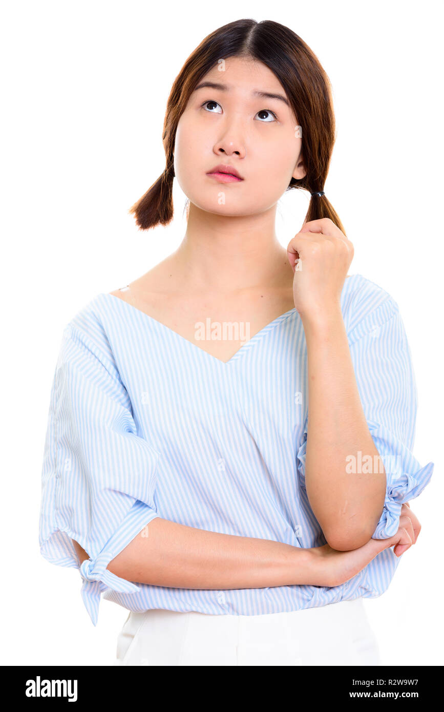 Studio erschossen Der junge schöne asiatische Frau denken, während lookin Stockfoto