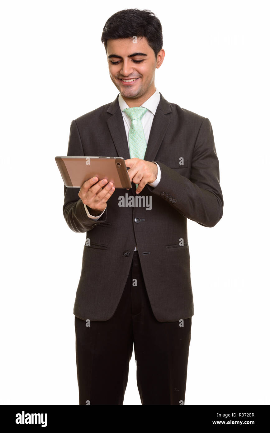 Junge glücklich Persischen Geschäftsmann mit digitalen Tablet Stockfoto