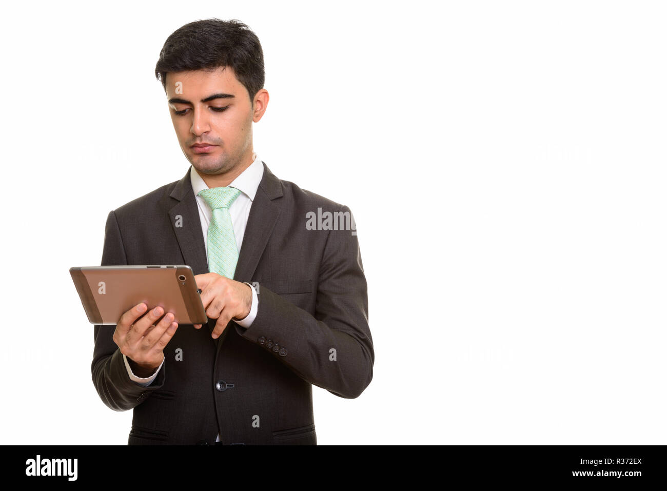 Jungen schönen persischen Geschäftsmann mit digitalen Tablet Stockfoto