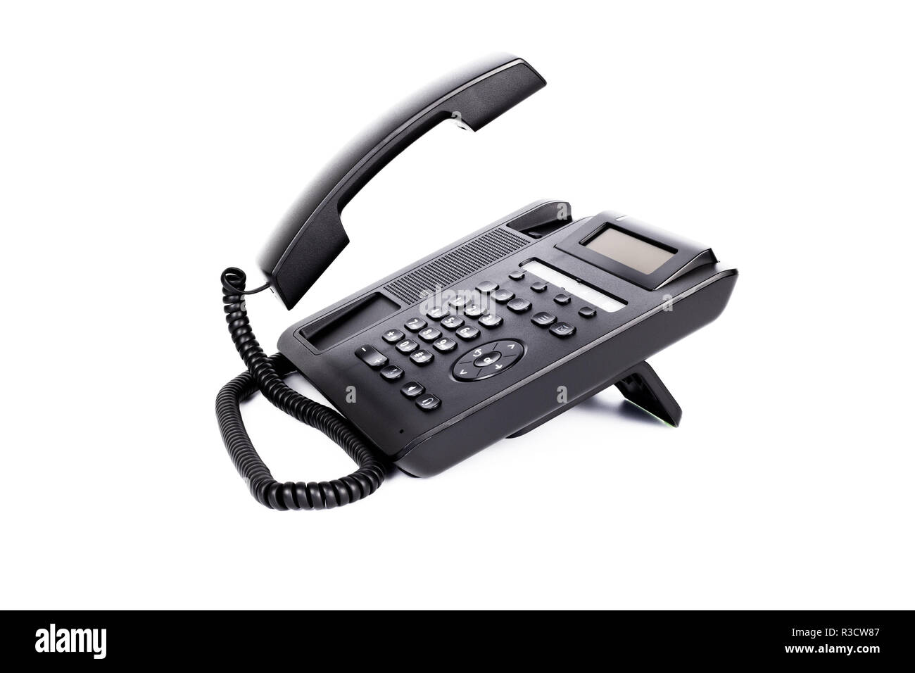 Eine schwarze IP Phone mit einem abgehobenen Hörer, auf weißem Hintergrund, Nahaufnahme Stockfoto