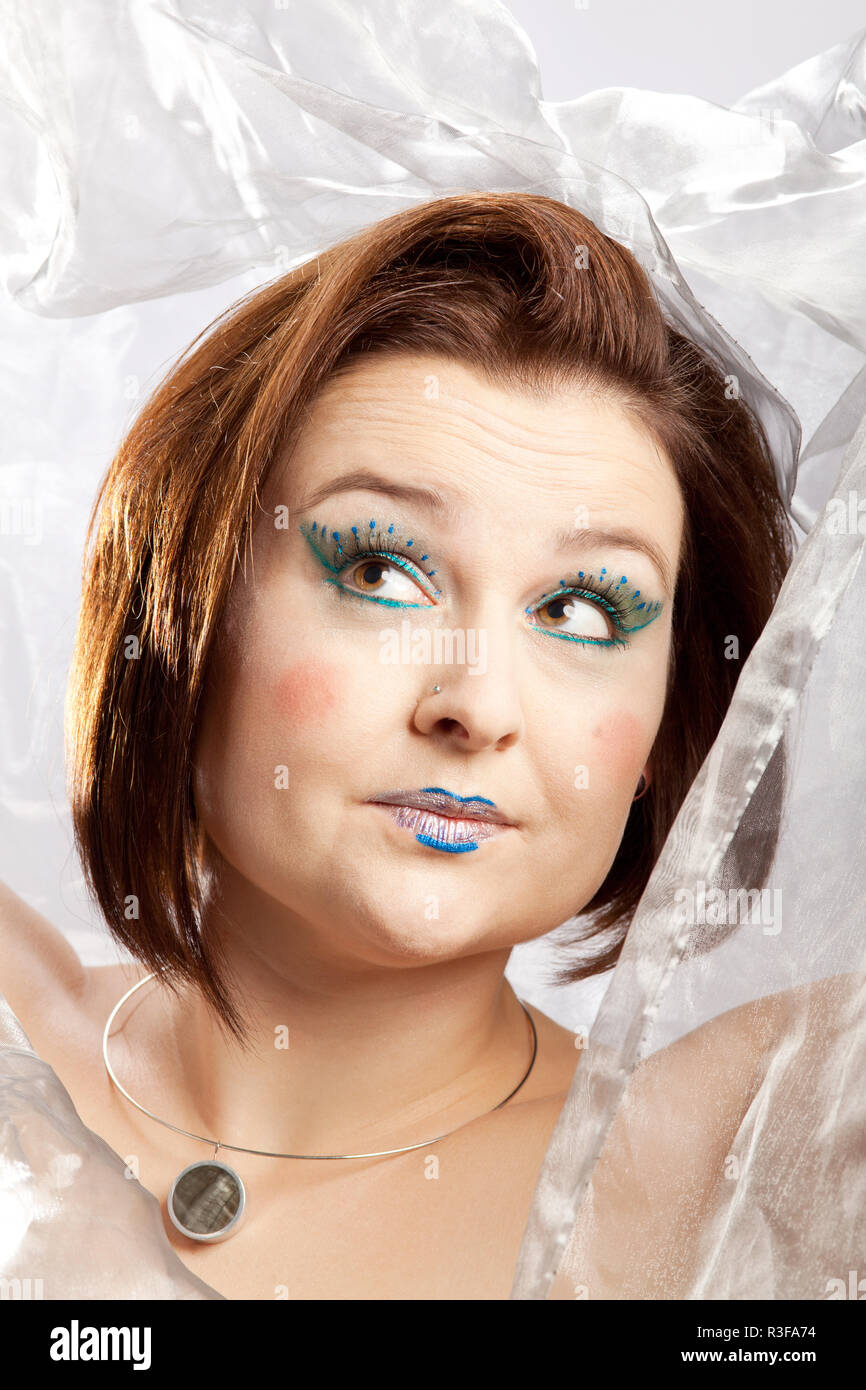 Prüfung auf einer Frau, die mit lustigen Make-up Stockfoto
